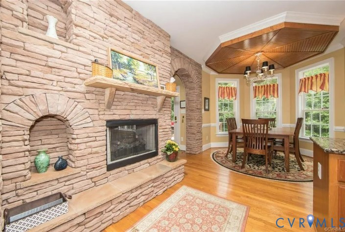 1638 Fallen Timber Trail Powhatan, VA 23139 - Photo 14 of 48 a living room with furniture a fireplace and floor to ceiling window