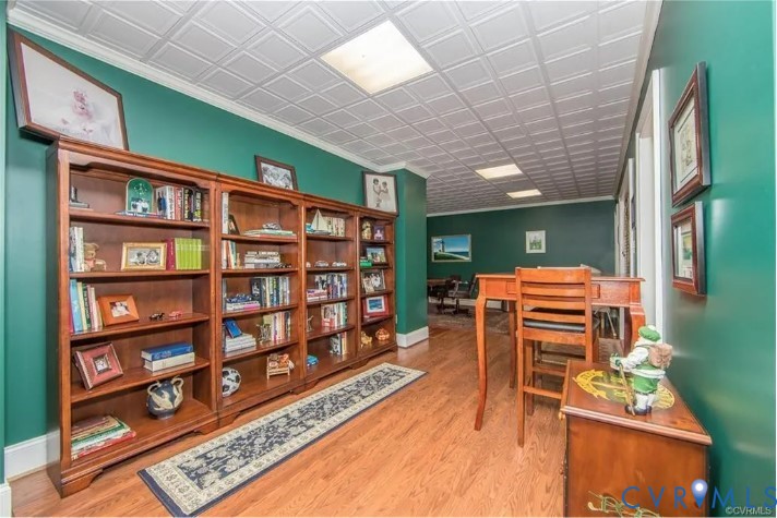 1638 Fallen Timber Trail Powhatan, VA 23139 - Photo 44 of 48 a living room with furniture a bookshelf and a bookshelf