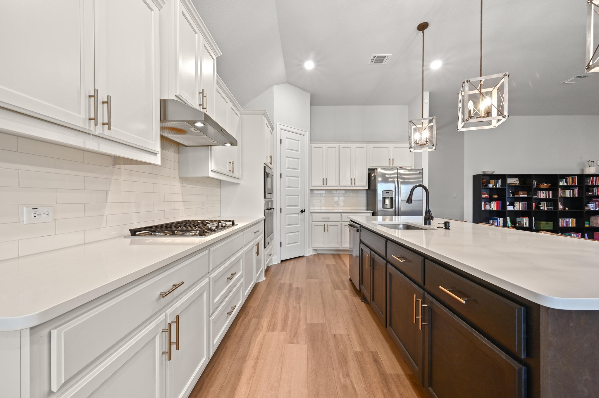 308 Allegheny Way Kyle, TX 78640 - Photo 13 of 40 a large kitchen with stainless steel appliances lots of counter space a sink and a stove