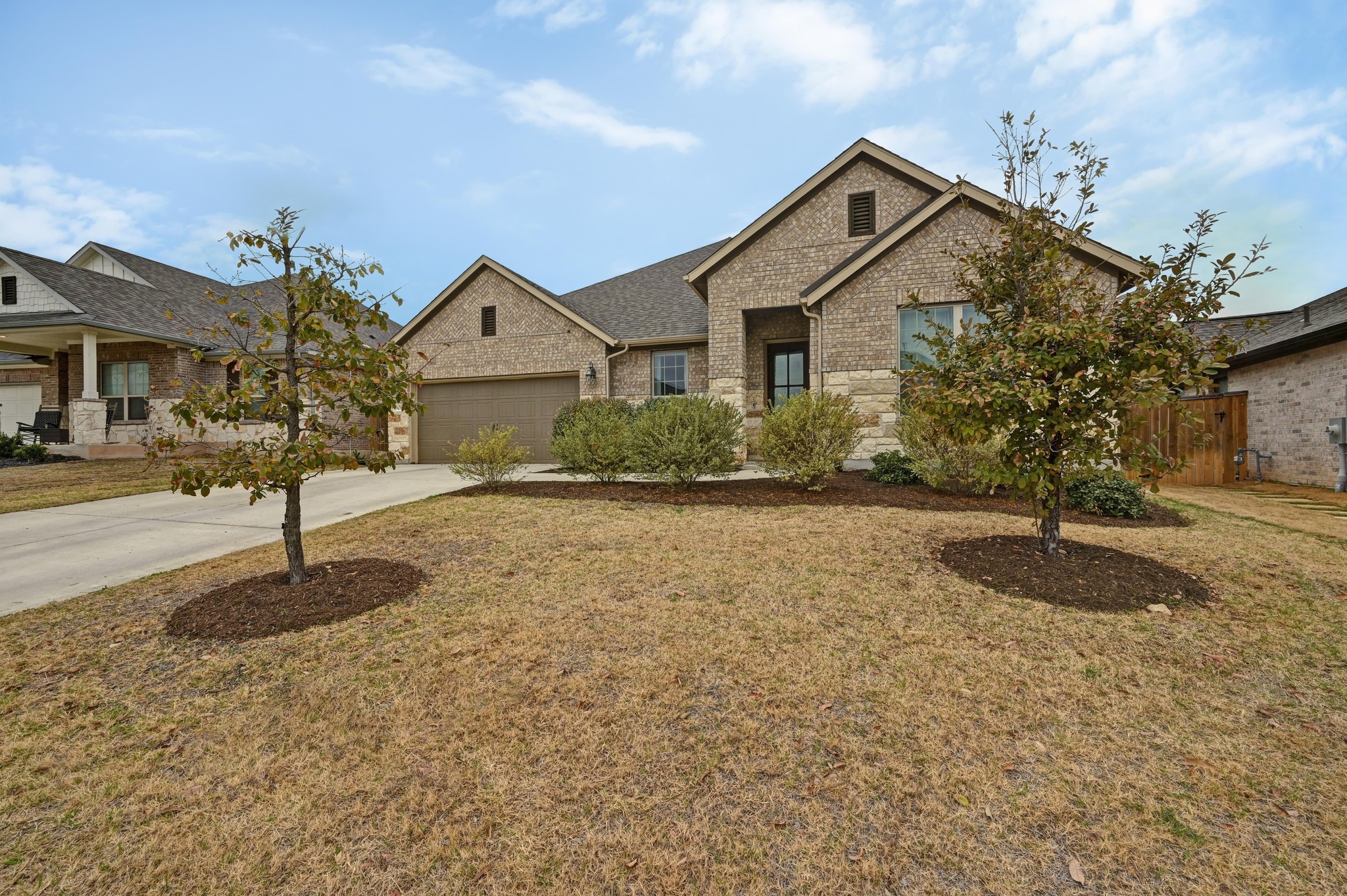 308 Allegheny Way Kyle, TX 78640 - Photo 2 of 40 a front view of a house with a yard