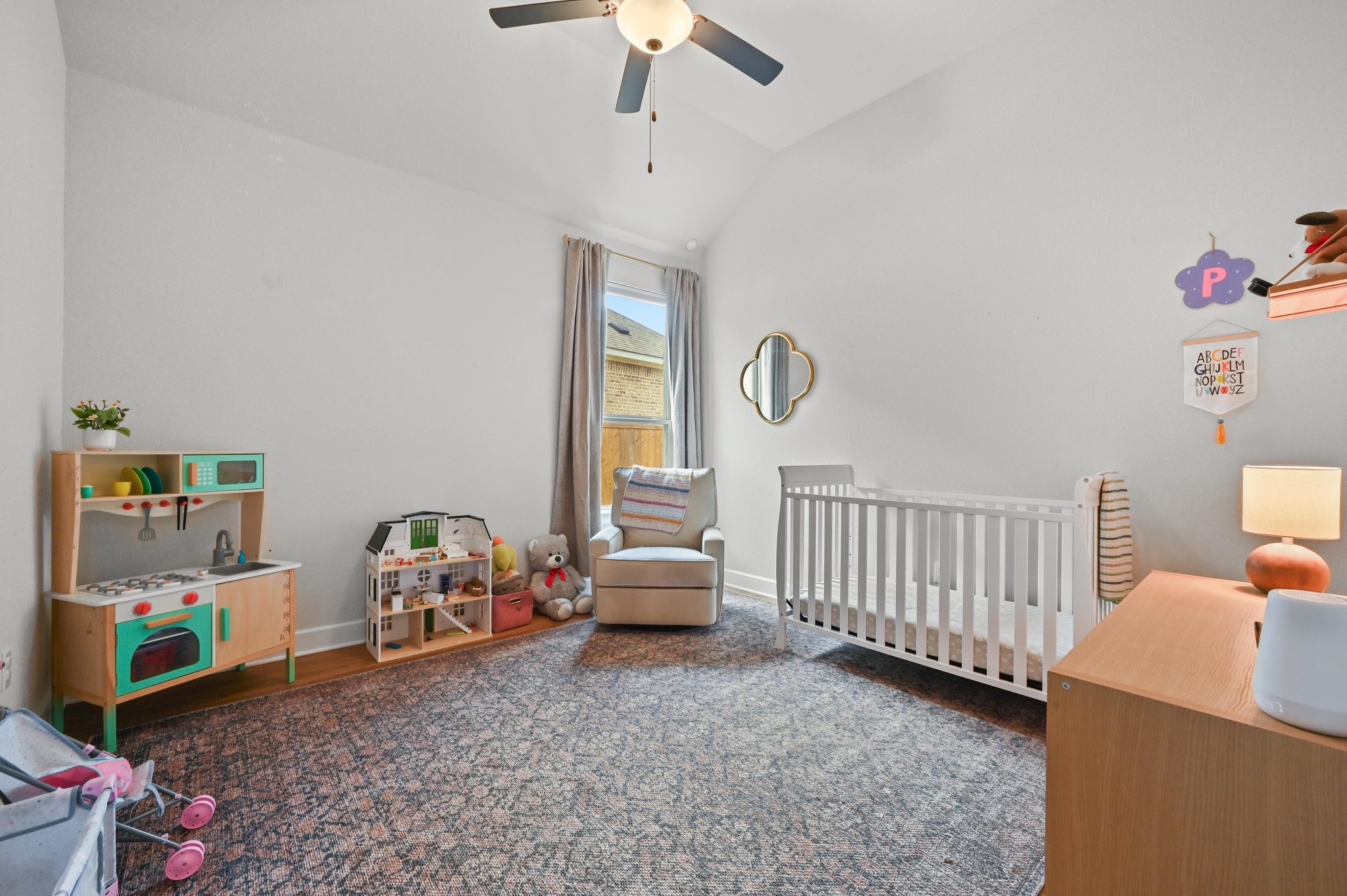 308 Allegheny Way Kyle, TX 78640 - Photo 21 of 40 Bedroom featuring a crib, lofted ceiling, ceiling fan, and dark wood-type flooring