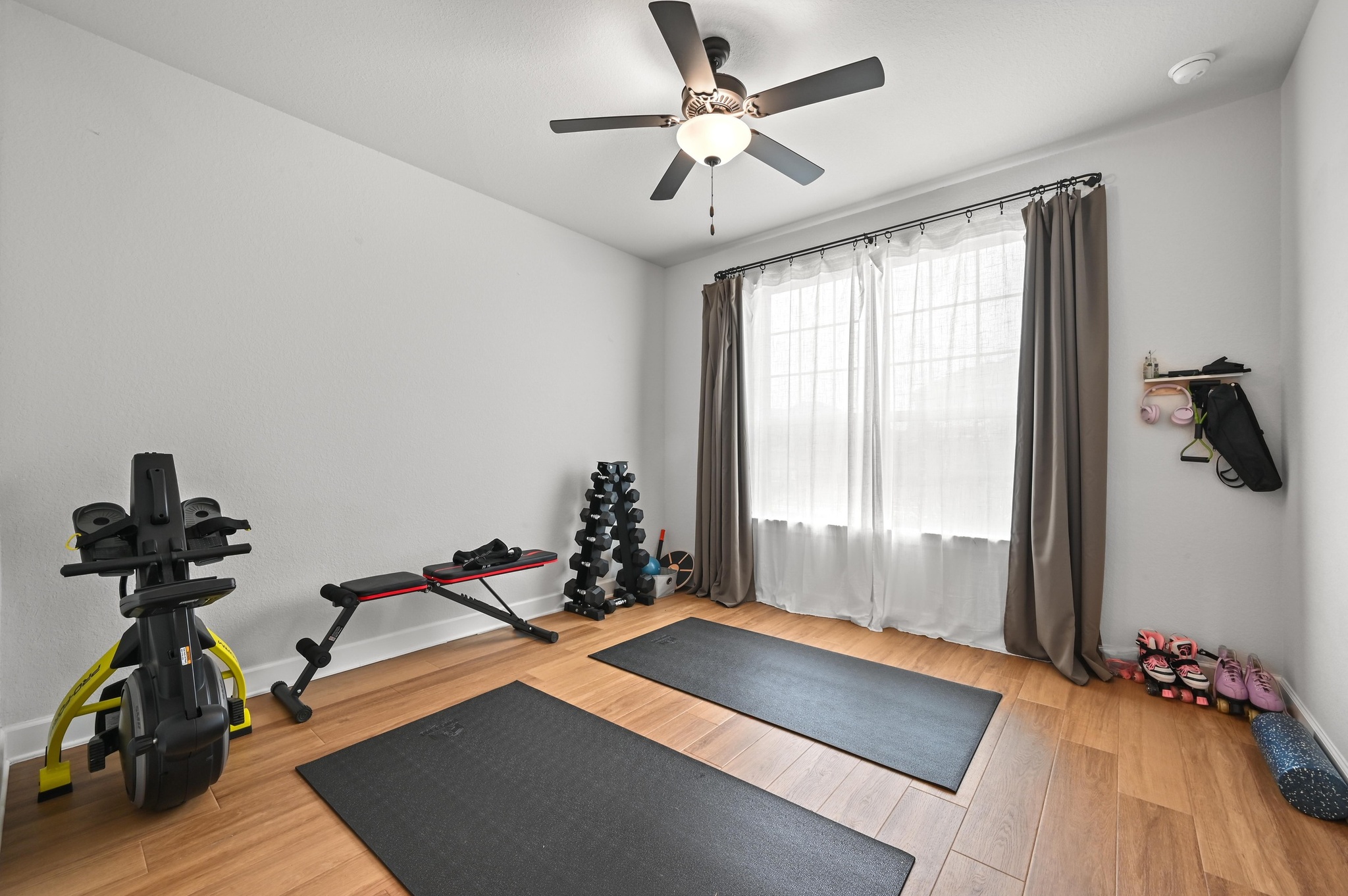 308 Allegheny Way Kyle, TX 78640 - Photo 23 of 40 Workout area featuring light wood finished floors and a ceiling fan