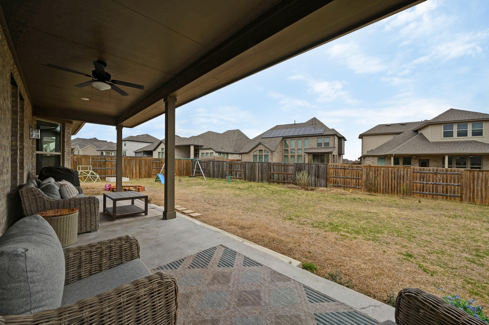 308 Allegheny Way Kyle, TX 78640 - Photo 26 of 40 a view of living room kitchen with furniture and floor to ceiling window