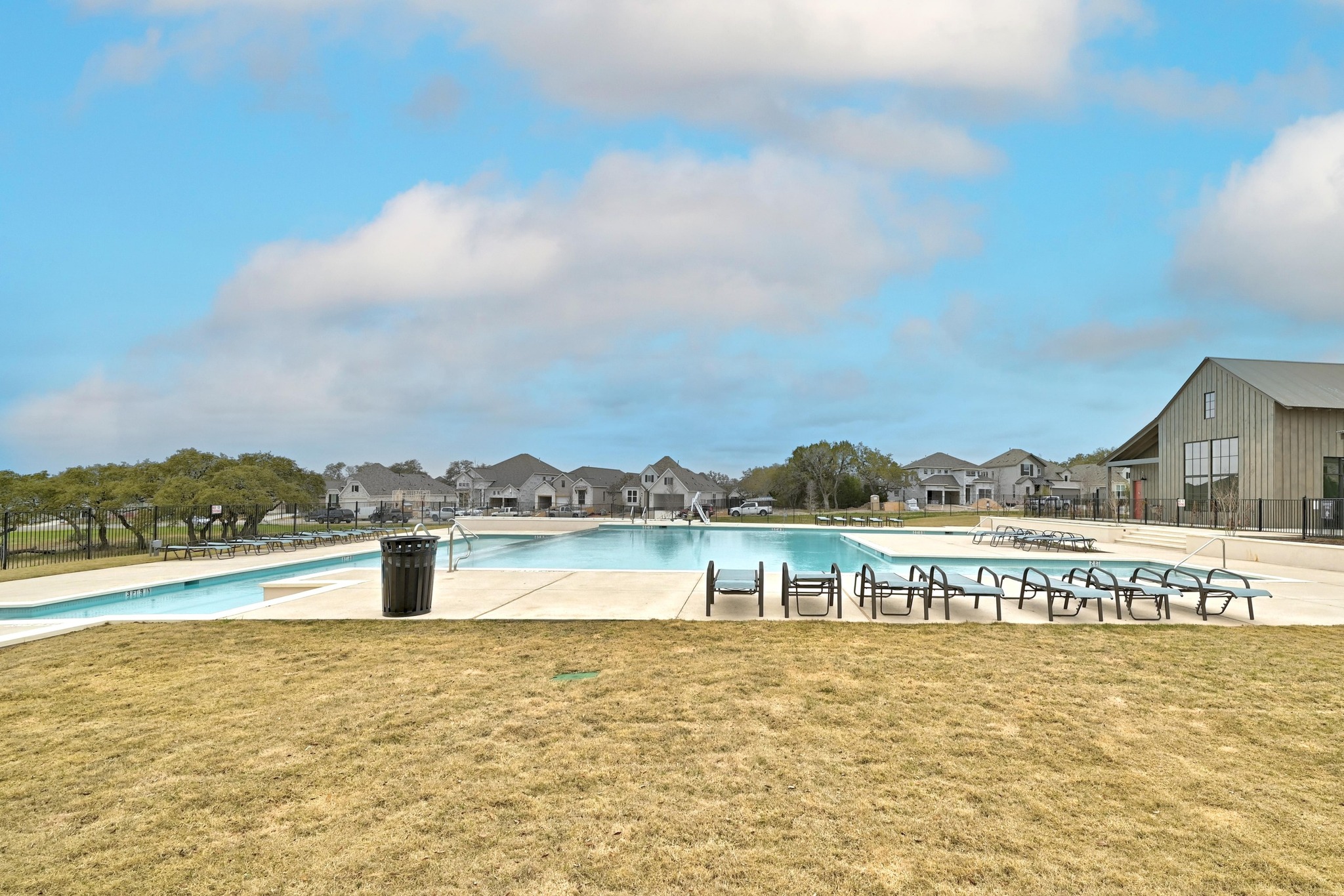 308 Allegheny Way Kyle, TX 78640 - Photo 32 of 40 Community pool featuring a residential view and a patio area