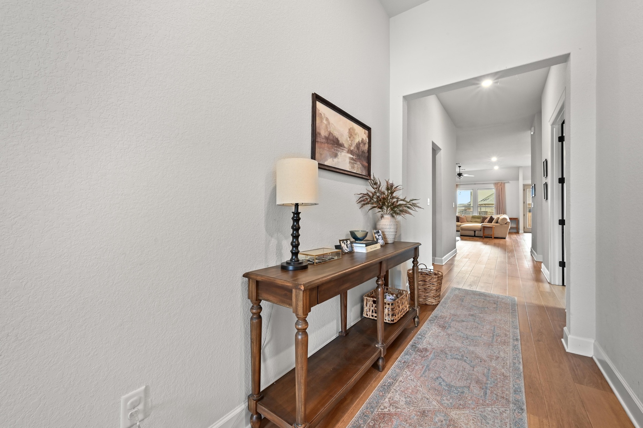 308 Allegheny Way Kyle, TX 78640 - Photo 4 of 40 Hallway with wood finished floors and baseboards