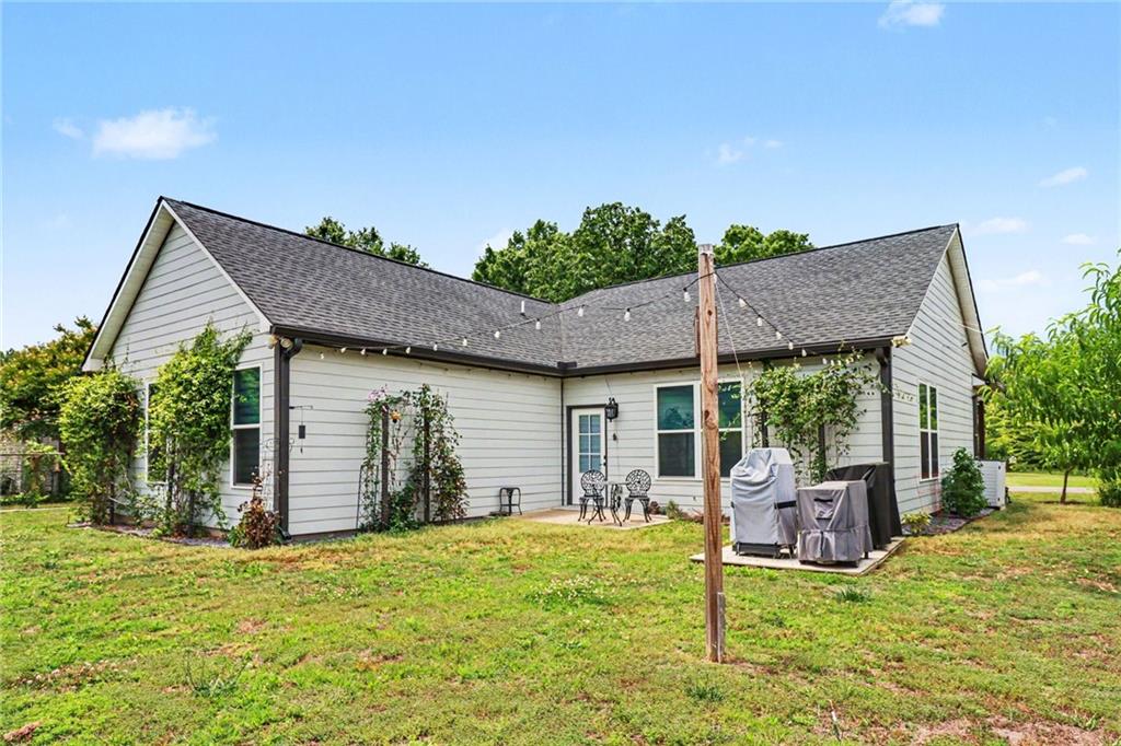 134 North Avery Road Northwest Rome, GA 30165 - Photo 6 of 10 a backyard of a house with table and chairs