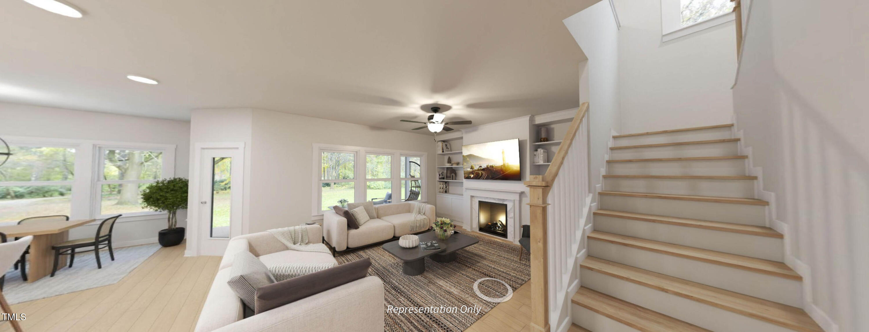 8733 Maxine Street Willow Spring, NC 27592 - Photo 11 of 34 a living room with furniture a fireplace and a chandelier