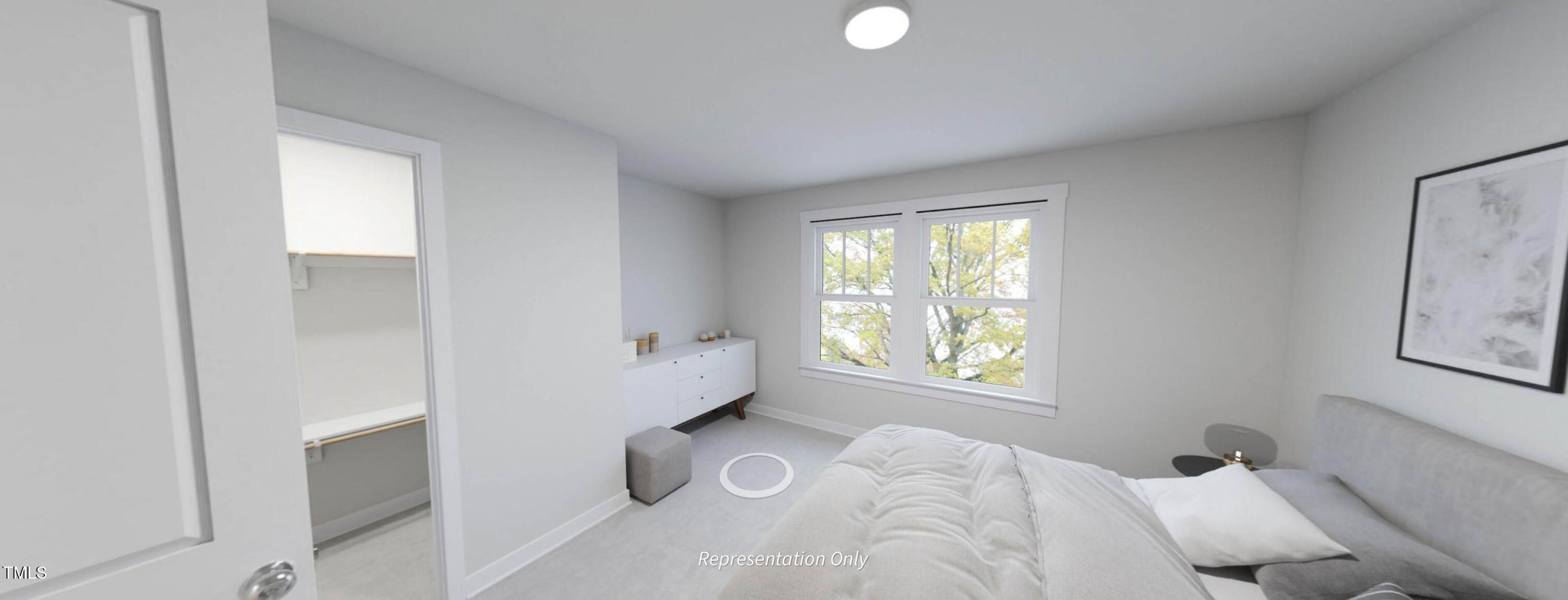 8733 Maxine Street Willow Spring, NC 27592 - Photo 23 of 34 a bedroom with a bed and a window