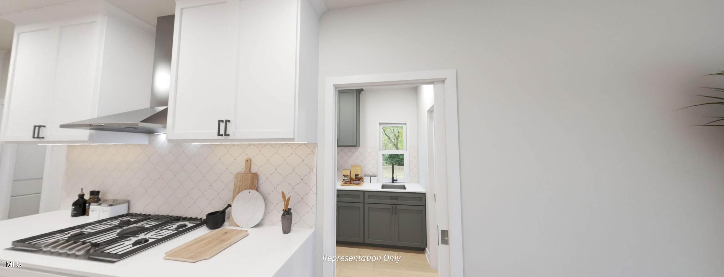 8733 Maxine Street Willow Spring, NC 27592 - Photo 7 of 34 a kitchen with a sink stove and cabinets