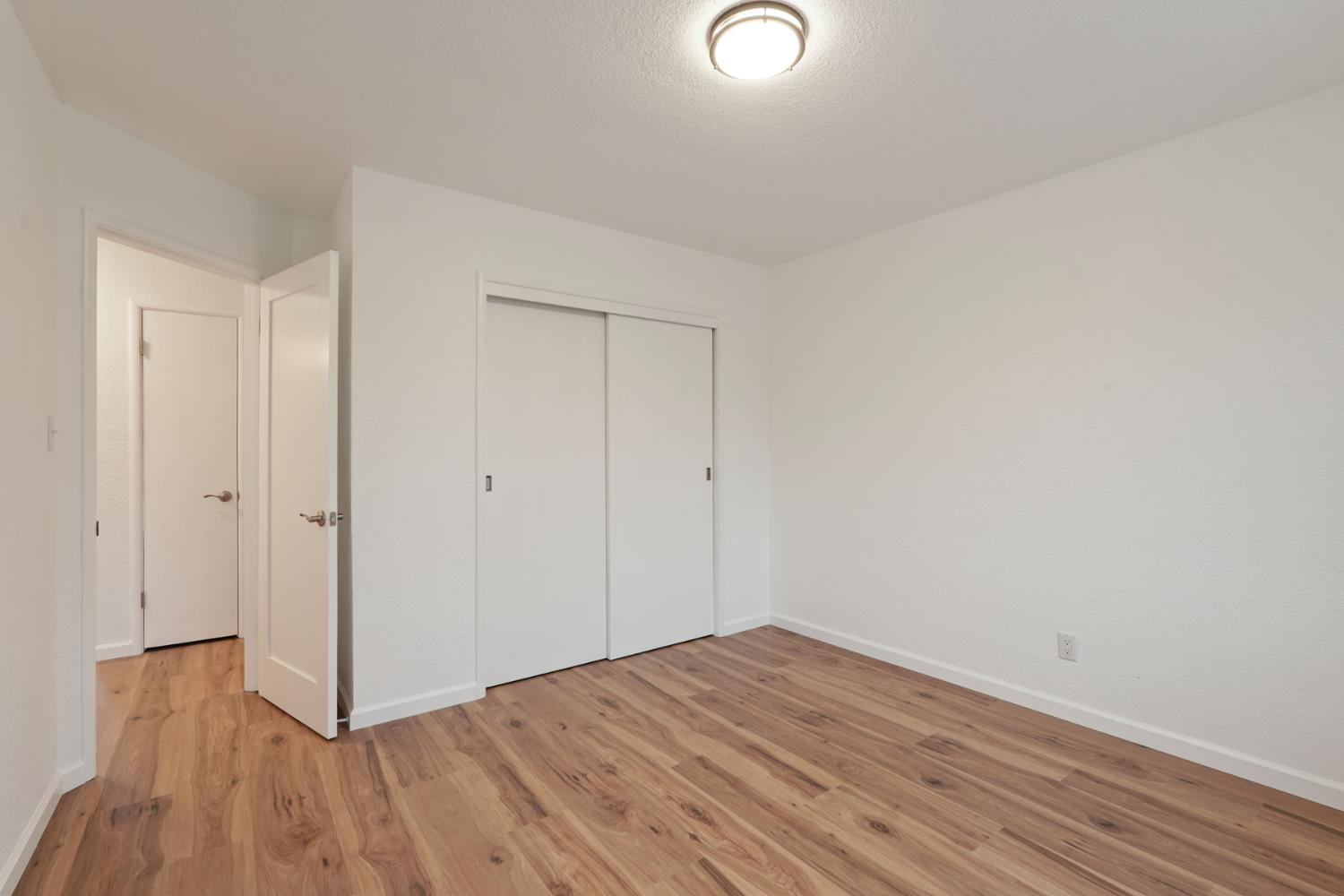 322 West Turner Road Lodi, CA 95240 - Photo 13 of 16 a view of a room with wooden floor