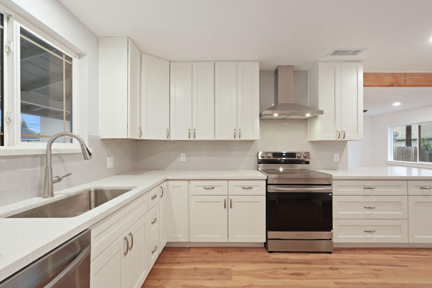 322 West Turner Road Lodi, CA 95240 - Photo 10 of 16 a kitchen with stainless steel appliances granite countertop a sink and a stove