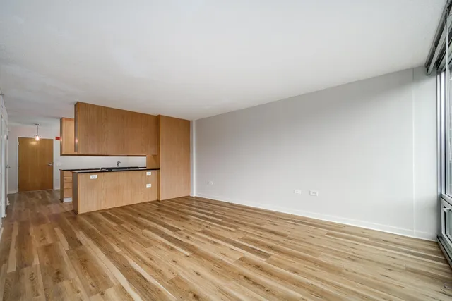 a bedroom with a bed and a television