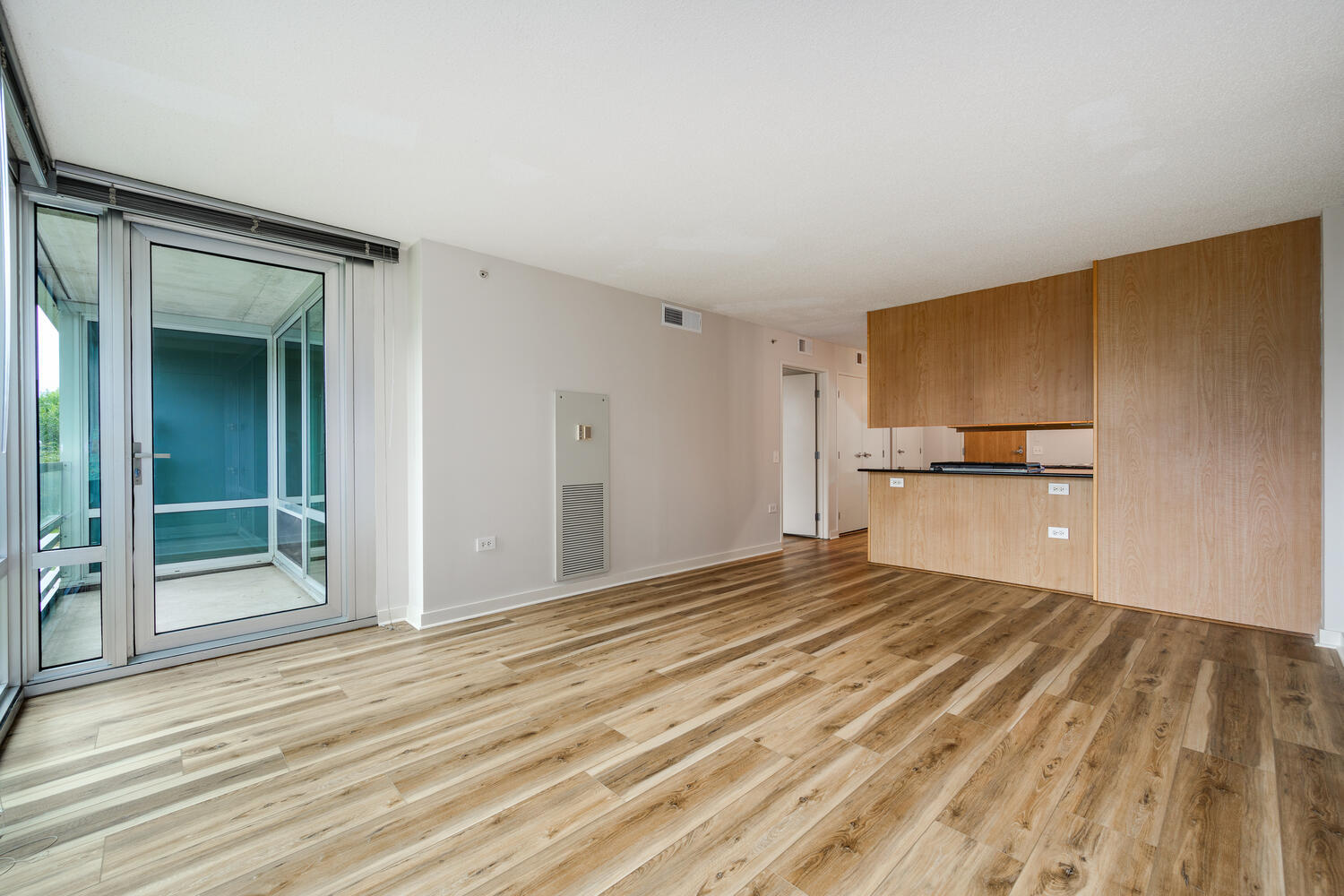 9655 Woods Drive, Unit 507 Skokie, IL 60077 - Photo 13 of 27 a view of a kitchen with wooden floor and a sink