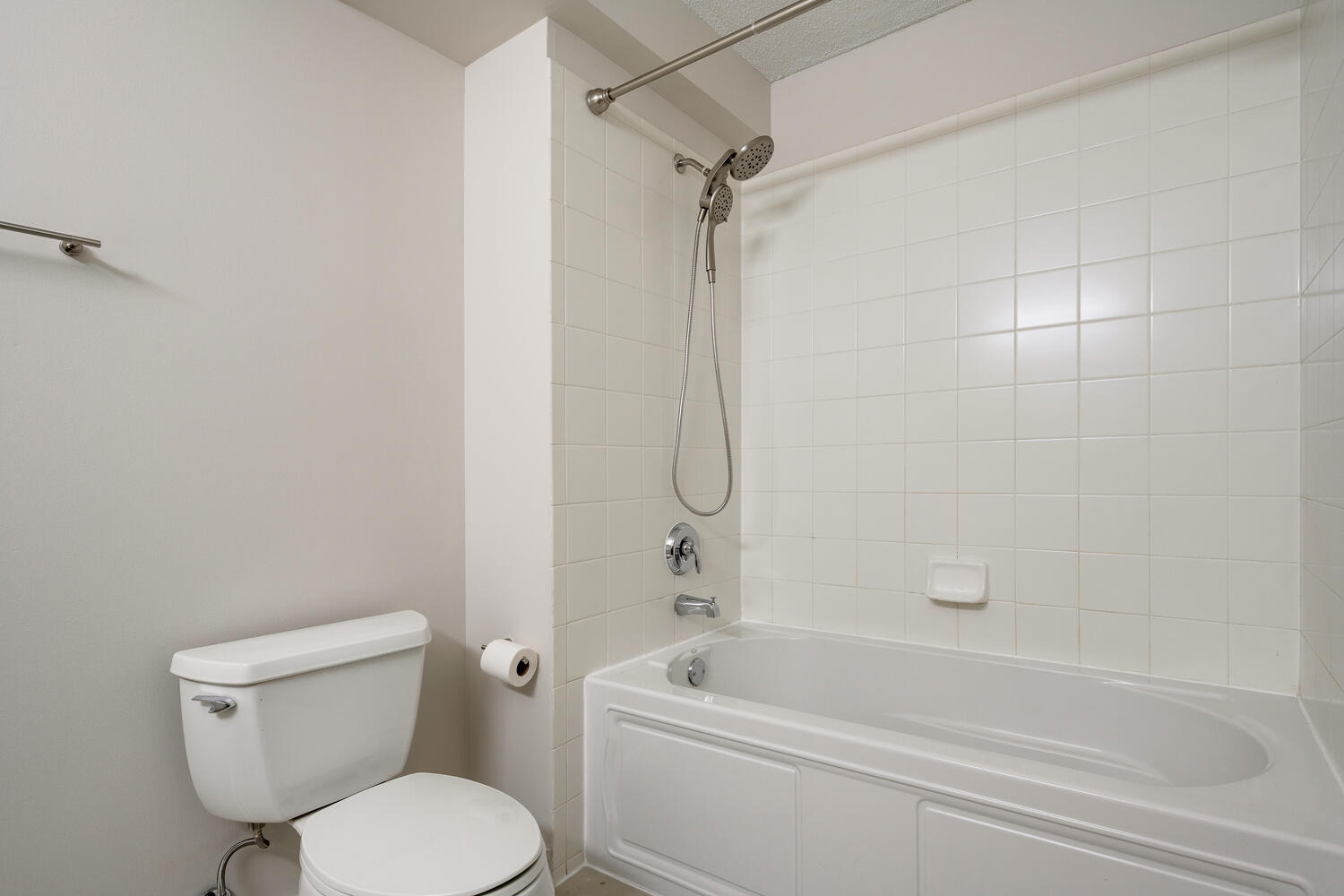 9655 Woods Drive, Unit 507 Skokie, IL 60077 - Photo 16 of 27 a white toilet and tub sitting next to a bathroom sink