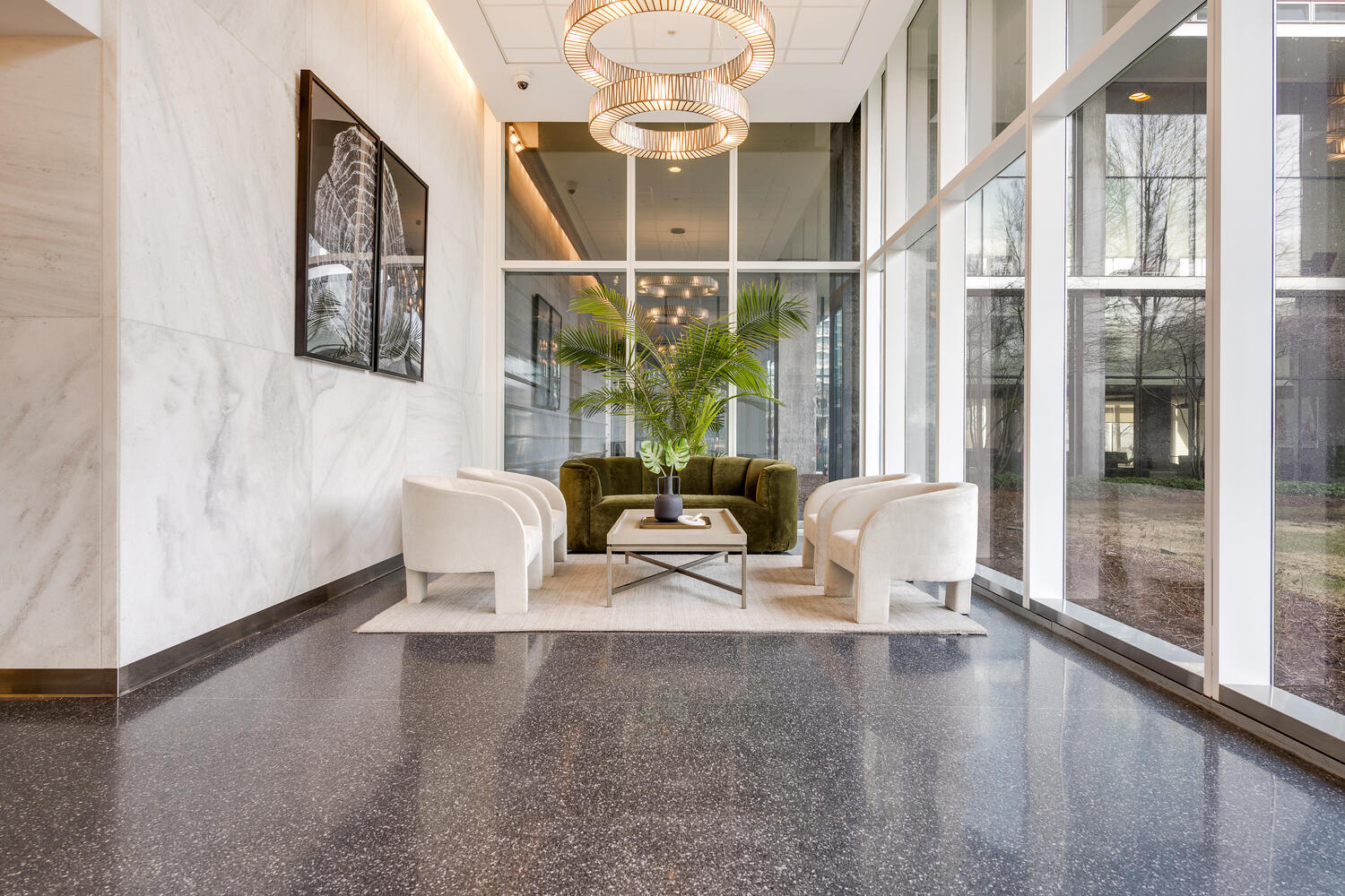 9655 Woods Drive, Unit 507 Skokie, IL 60077 - Photo 2 of 27 a dining room with furniture a chandelier and wooden floor