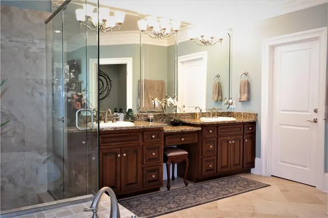 a bathroom with a double vanity sink and a mirror