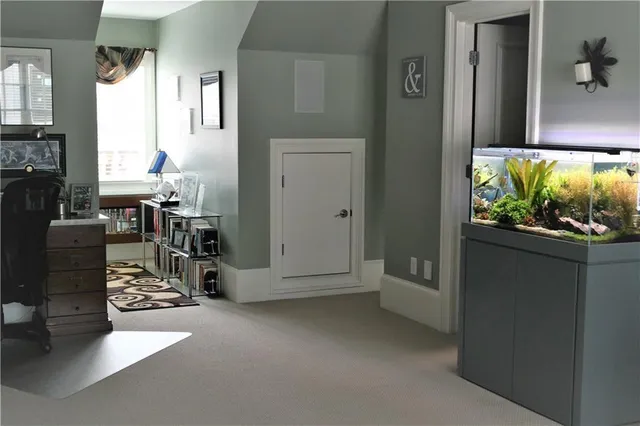 a view of a livingroom with furniture and windows
