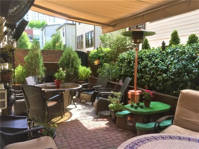 a view of an outdoor sitting area with a tub