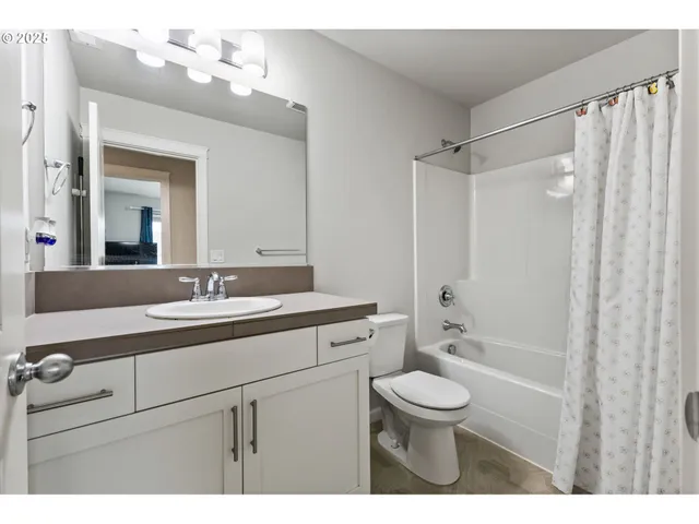 a bathroom with a toilet a sink and a bathtub