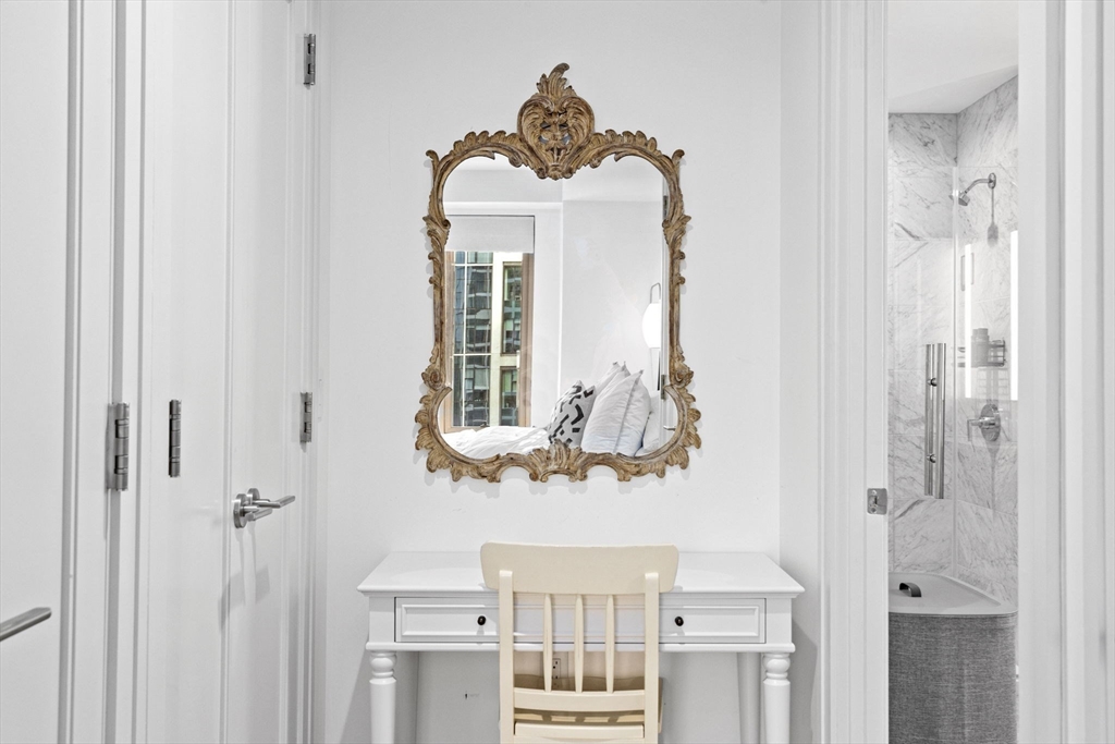 133 Seaport Boulevard, Unit 1603 Boston, MA 02210 - Photo 17 of 32 a bathroom with a window and a mirror