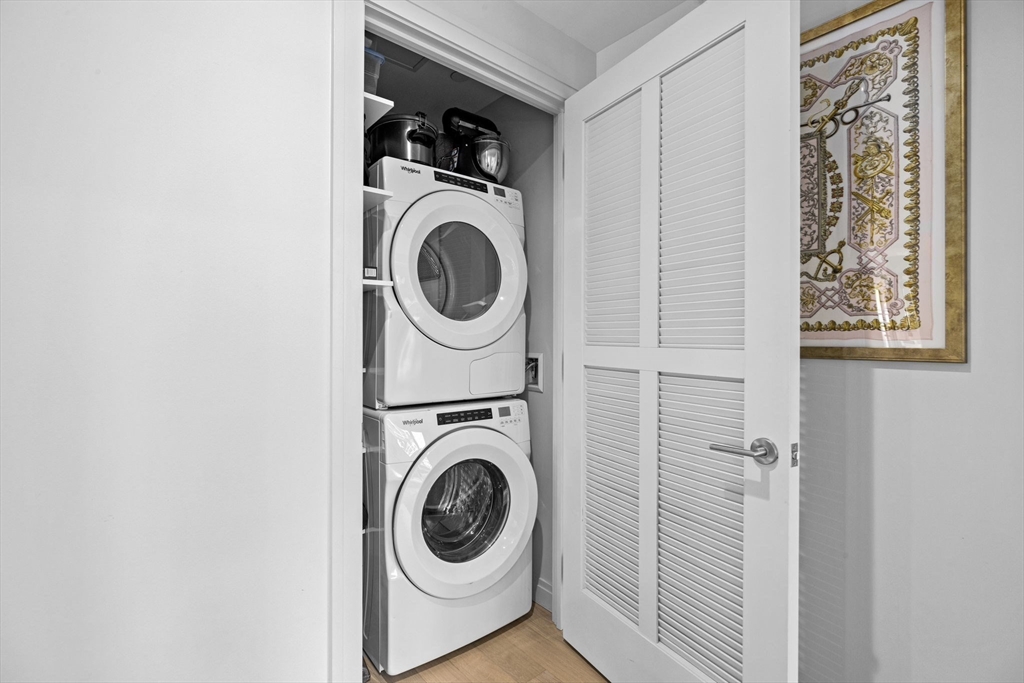 133 Seaport Boulevard, Unit 1603 Boston, MA 02210 - Photo 19 of 32 a utility room with dryer and washer