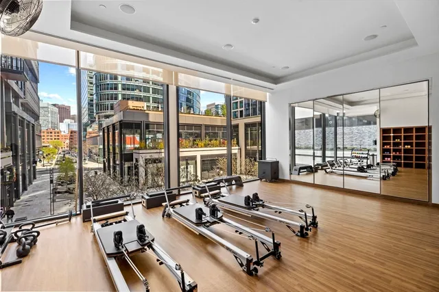 a large kitchen with a table and chairs