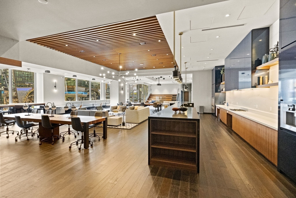 133 Seaport Boulevard, Unit 1603 Boston, MA 02210 - Photo 21 of 32 a large kitchen with a table and chairs