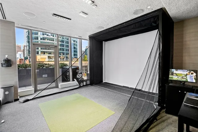 a view of a patio with dining table and chairs