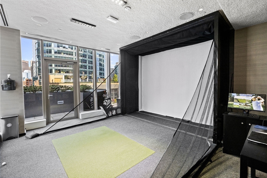 133 Seaport Boulevard, Unit 1603 Boston, MA 02210 - Photo 24 of 32 a view of a room with gym equipment