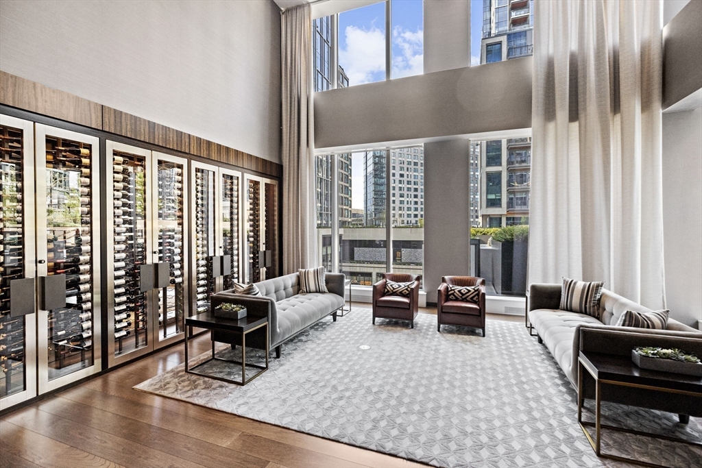 133 Seaport Boulevard, Unit 1603 Boston, MA 02210 - Photo 27 of 32 a living room with furniture large window and a table