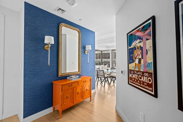 an entryway with wooden floor