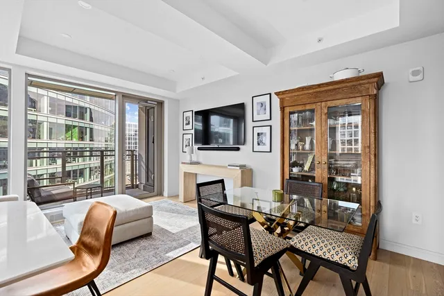 a living room with furniture fireplace and a flat screen tv