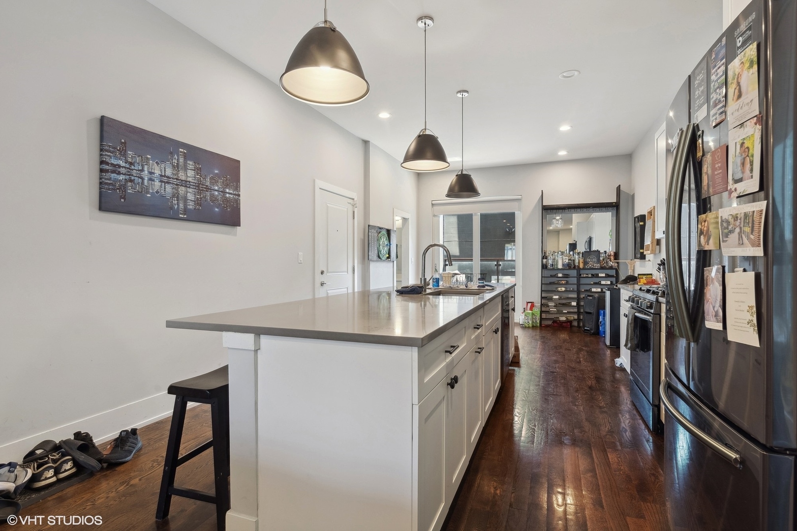 3719 North Seminary Avenue Chicago, IL 60613 - Photo 18 of 26 a kitchen with stainless steel appliances kitchen island a large island in the center