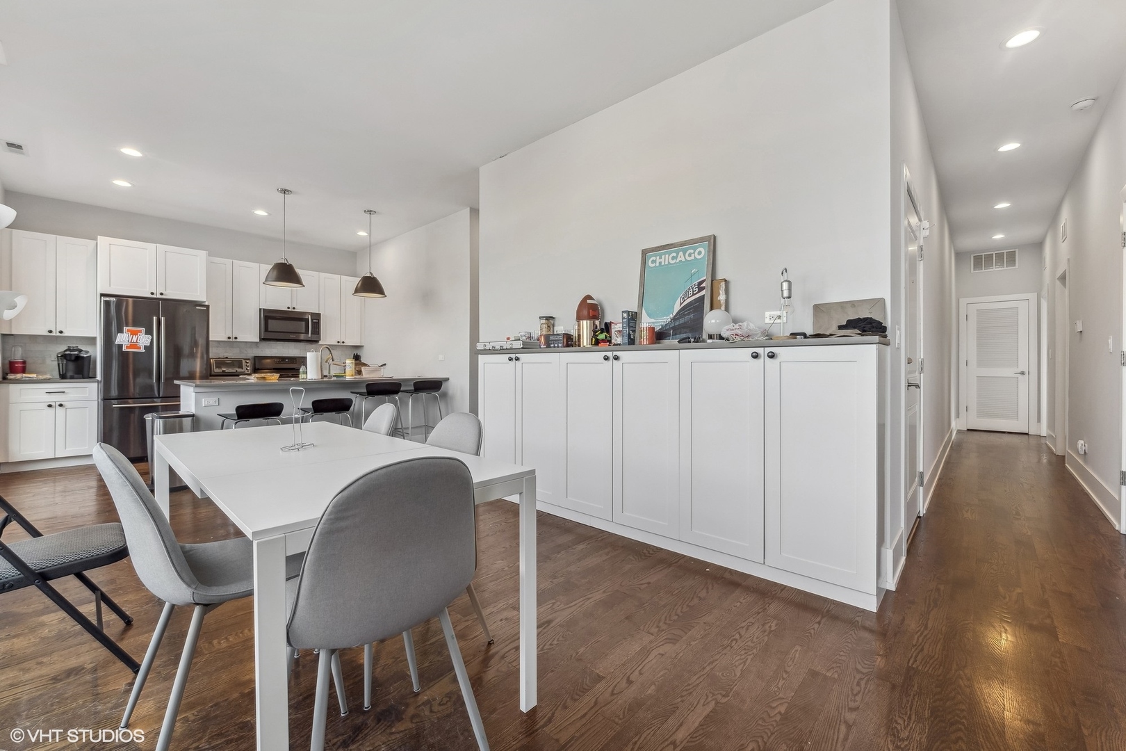 3719 North Seminary Avenue Chicago, IL 60613 - Photo 5 of 26 a kitchen with stainless steel appliances a table and chairs in it