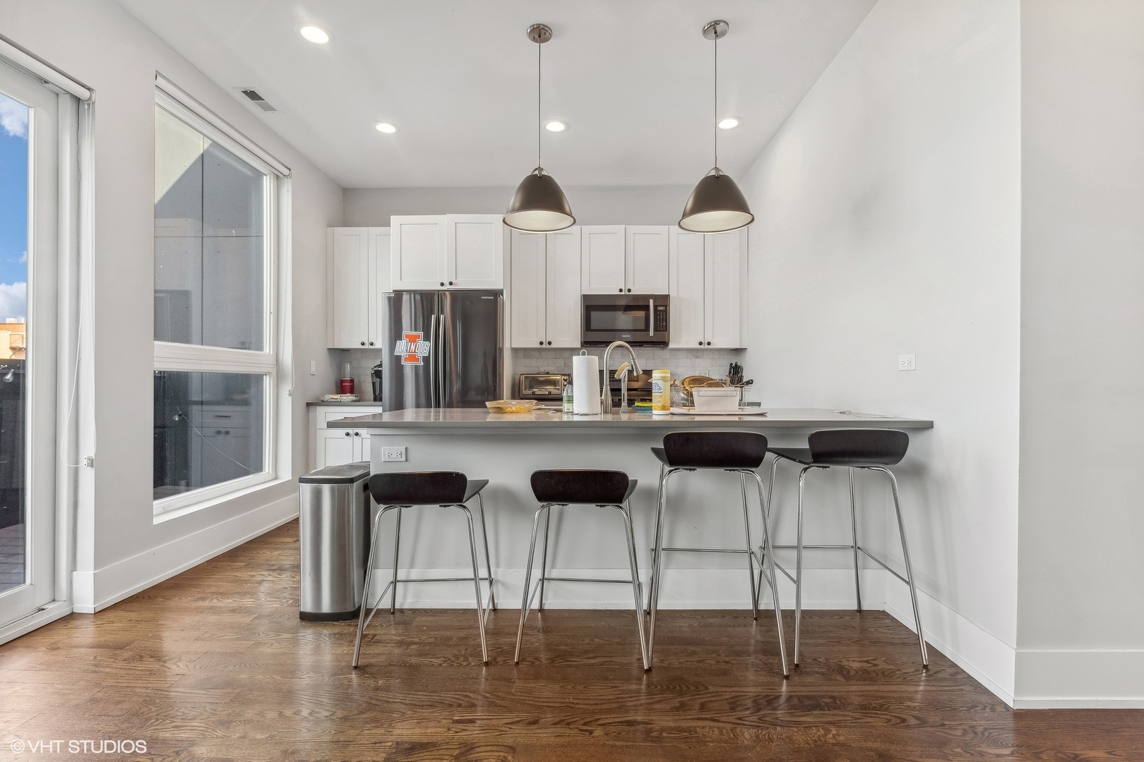 3719 North Seminary Avenue Chicago, IL 60613 - Photo 7 of 26 a kitchen with stainless steel appliances kitchen island granite countertop a stove a sink and a refrigerator