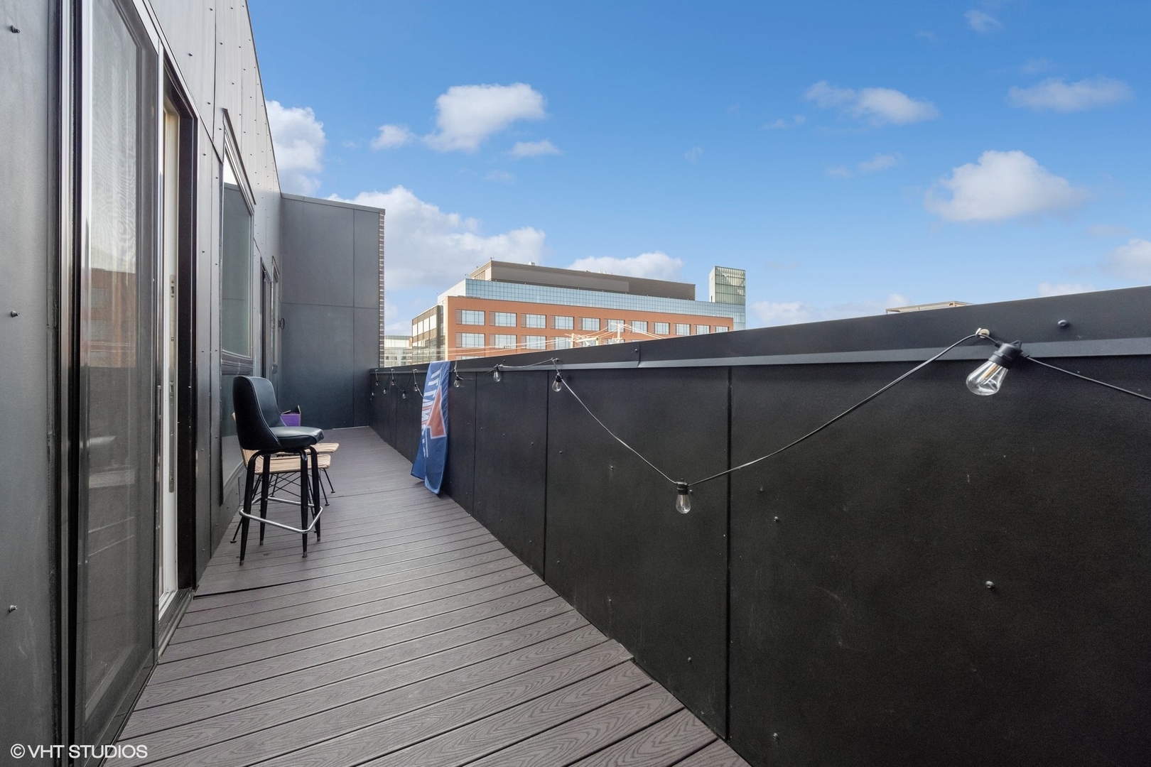 3719 North Seminary Avenue Chicago, IL 60613 - Photo 9 of 26 a view of a balcony with furniture and wooden floor