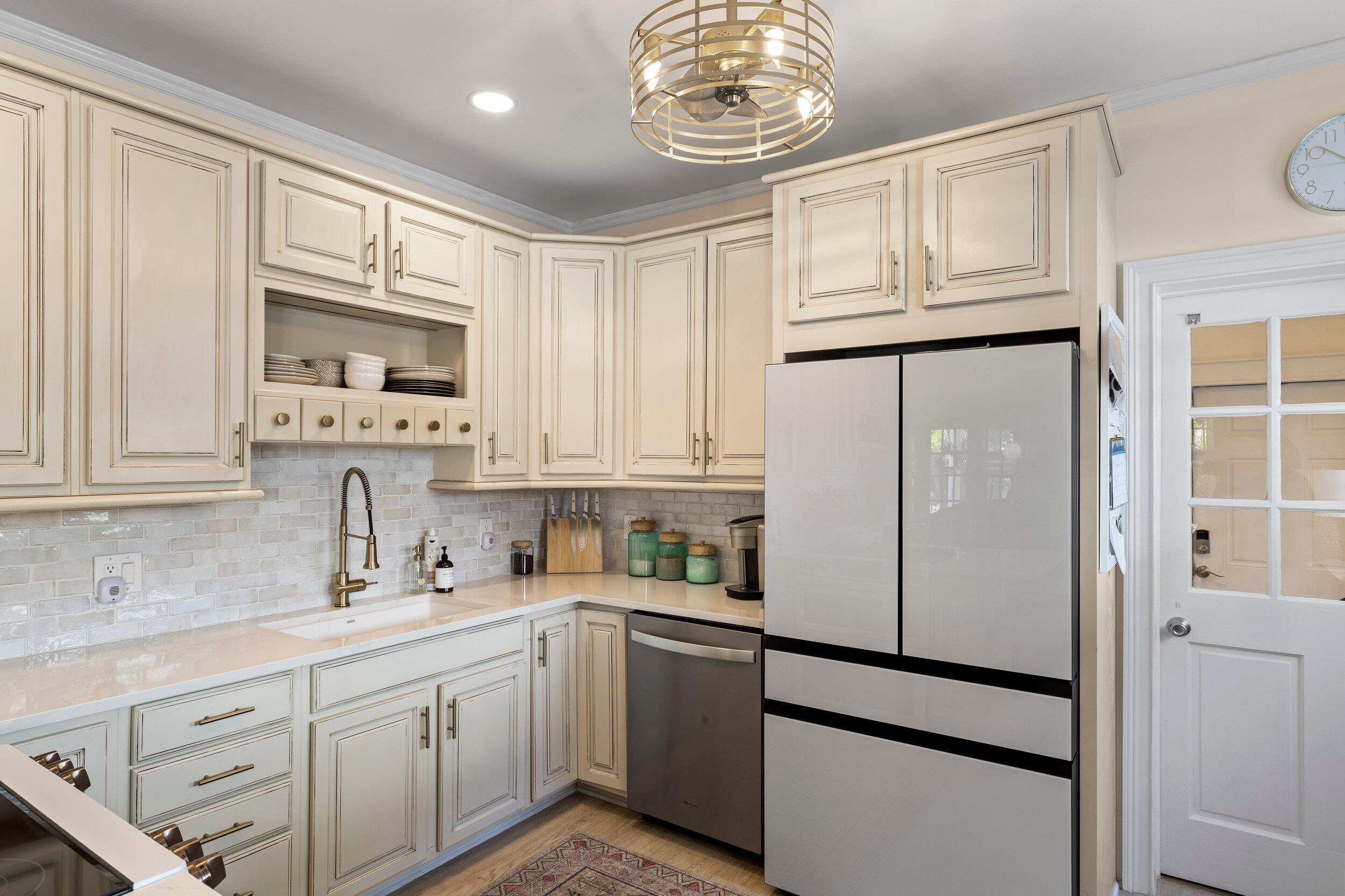 1420 White Street Key West, FL 33040 - Photo 13 of 48 a white refrigerator freezer sitting inside of a kitchen