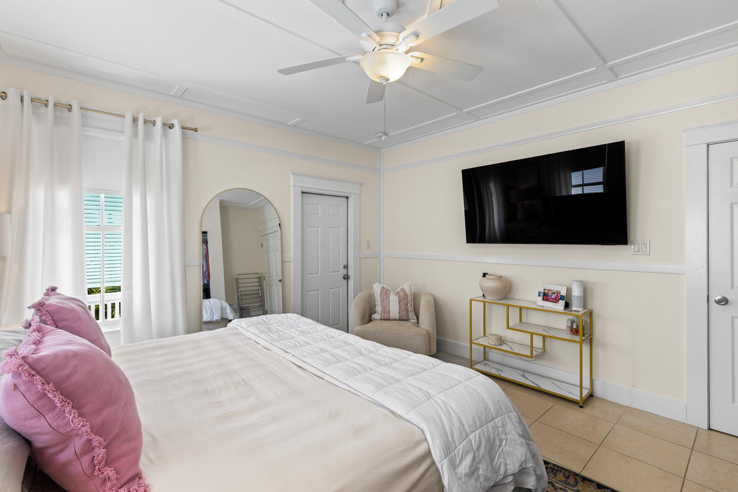 1420 White Street Key West, FL 33040 - Photo 26 of 48 a bedroom with a bed and a flat screen tv