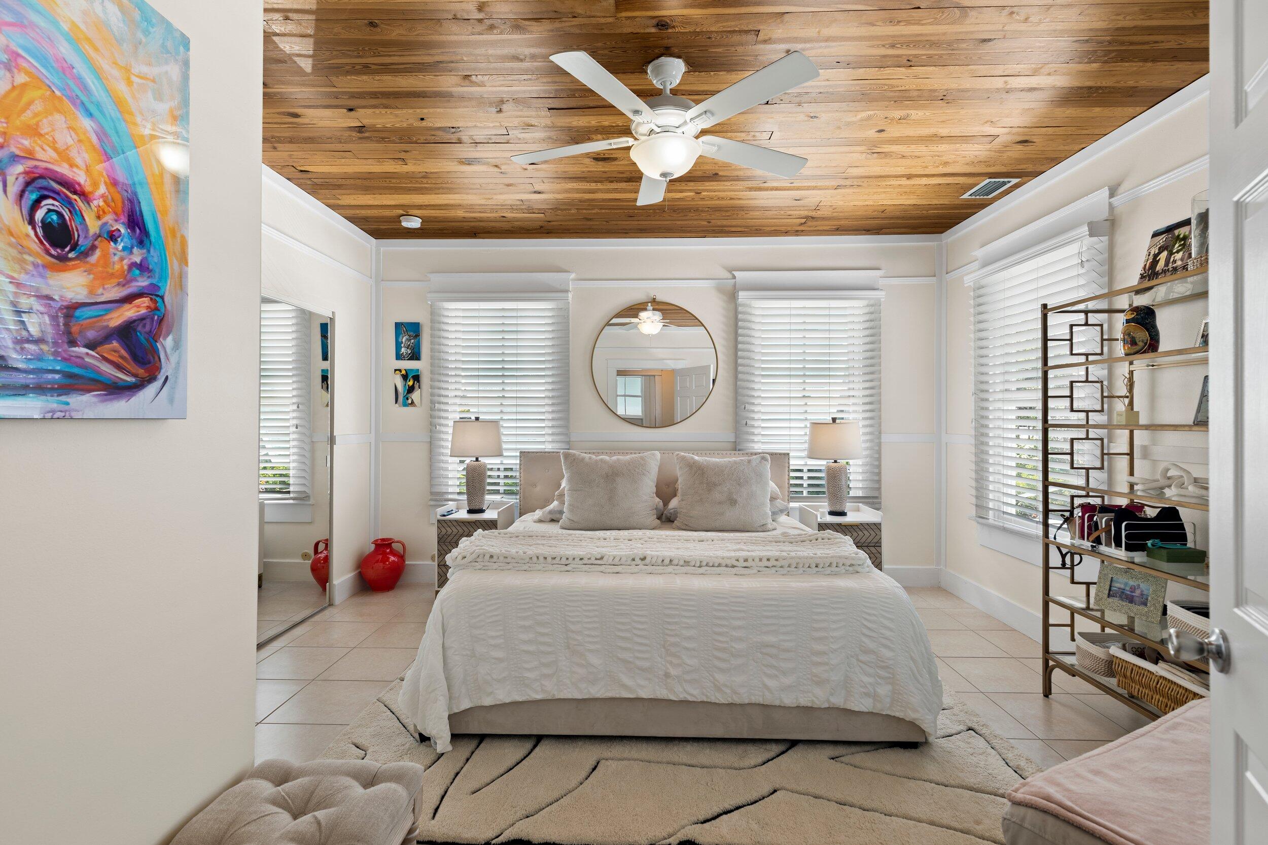 1420 White Street Key West, FL 33040 - Photo 32 of 48 a bedroom with a bed and a chandelier