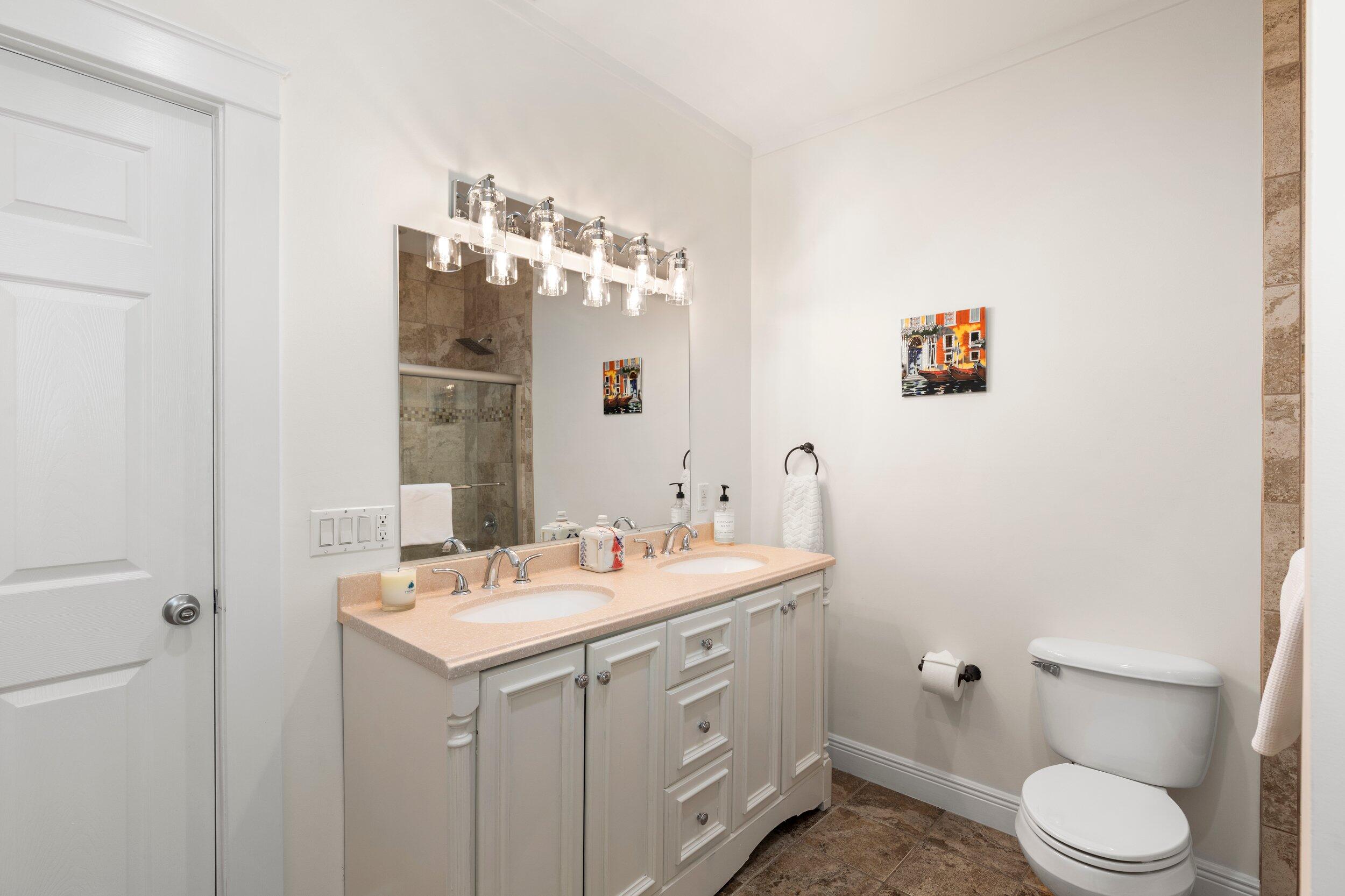 1420 White Street Key West, FL 33040 - Photo 36 of 48 a bathroom with a sink a toilet and mirror