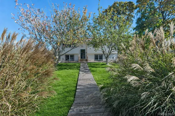a bathroom with a sink vanity and a mirror