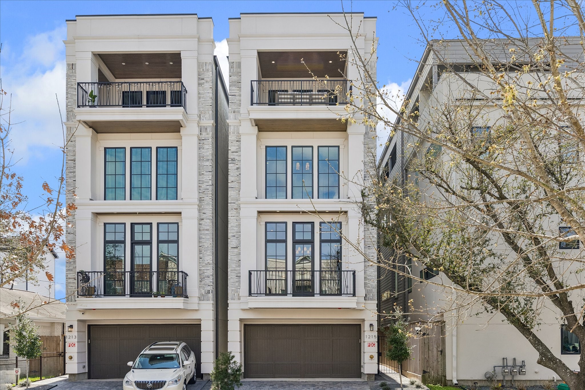 Exceptional materials combine with unrivaled craftsmanship in this remarkable home from the 2024 GHBA Custom Builder of the Year, Fifty Seventh & 7th Luxury Homes.
The lavish living room, complete with custom built-ins, stacked stone fireplace, and floor-to-ceiling windows. Twelve-foot ceilings, elegant crown moulding, and understated chandelier by Ziba create warmth and elegance.