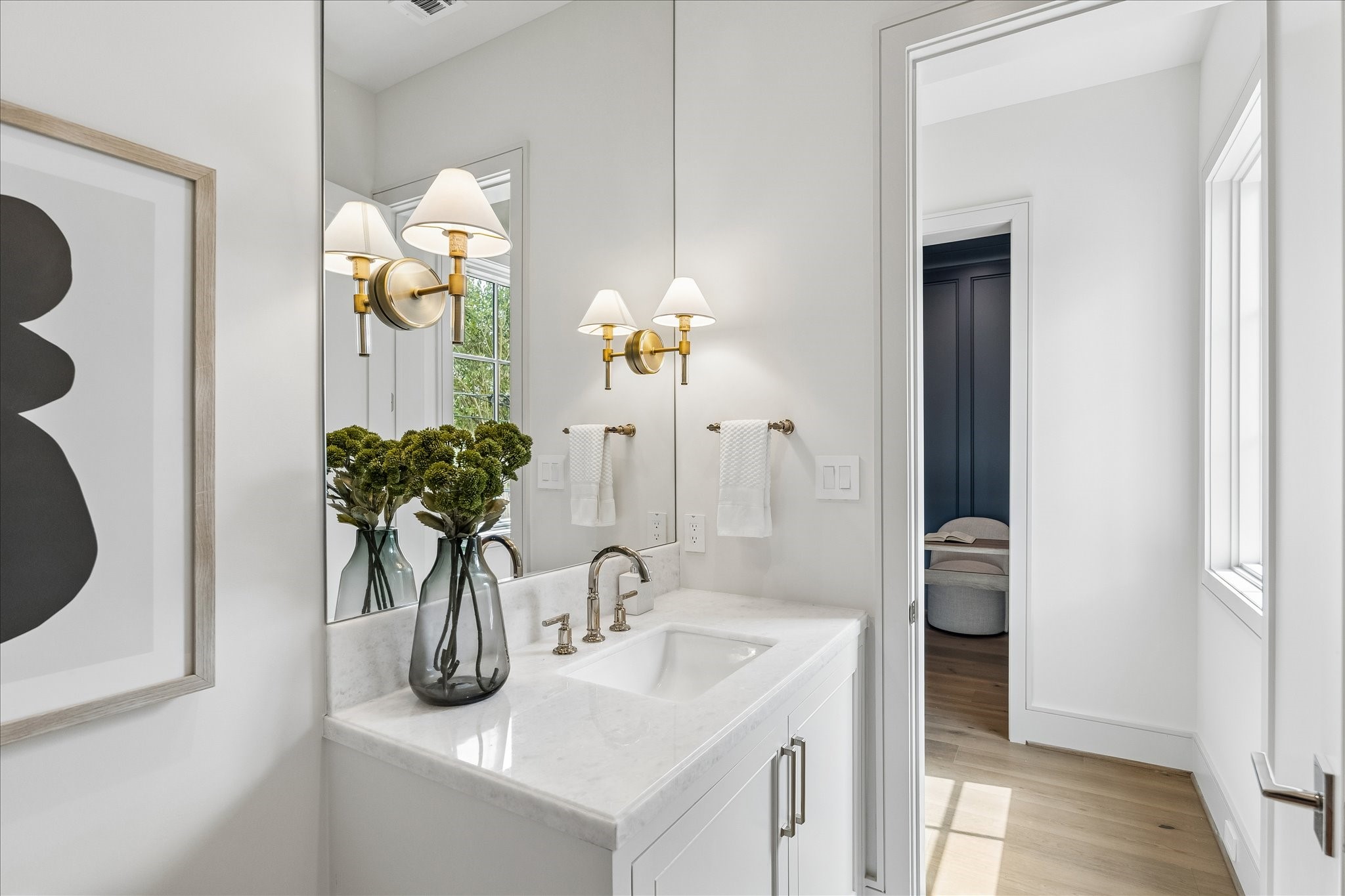 1215 West Pierce Street Houston, TX 77019 - Photo 17 of 37 Behind the kitchen, tucked discreetly out of sight, is the powder room. With plenty of space, marble counters, and polished gold fixtures, you and your guests will feel comfortable and taken care of.