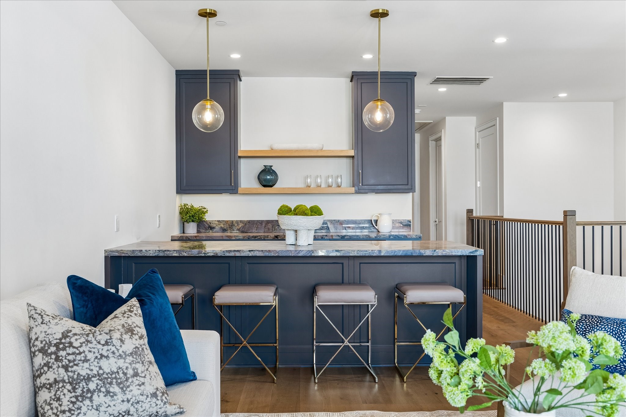 1215 West Pierce Street Houston, TX 77019 - Photo 27 of 37 The wet bar has a dynamic Marbella quartzite slab counter. The black quartz sink and Brizo Odin bar faucet will aid you in preparing snacks or cocktails. The opening will house a beverage cooler.