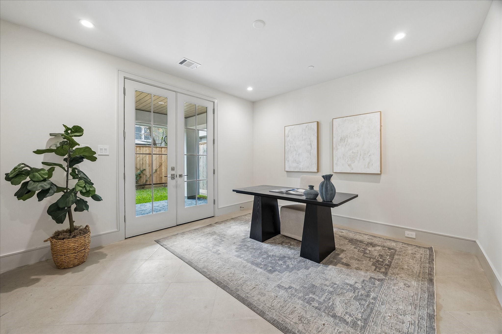 1215 West Pierce Street Houston, TX 77019 - Photo 9 of 37 The first floor bedroom can be used as a bedroom, office, or gym. The French doors open to the Pavilion or backyard, which will be customized to the new home-owner's preference with pavers or artificial turf.
