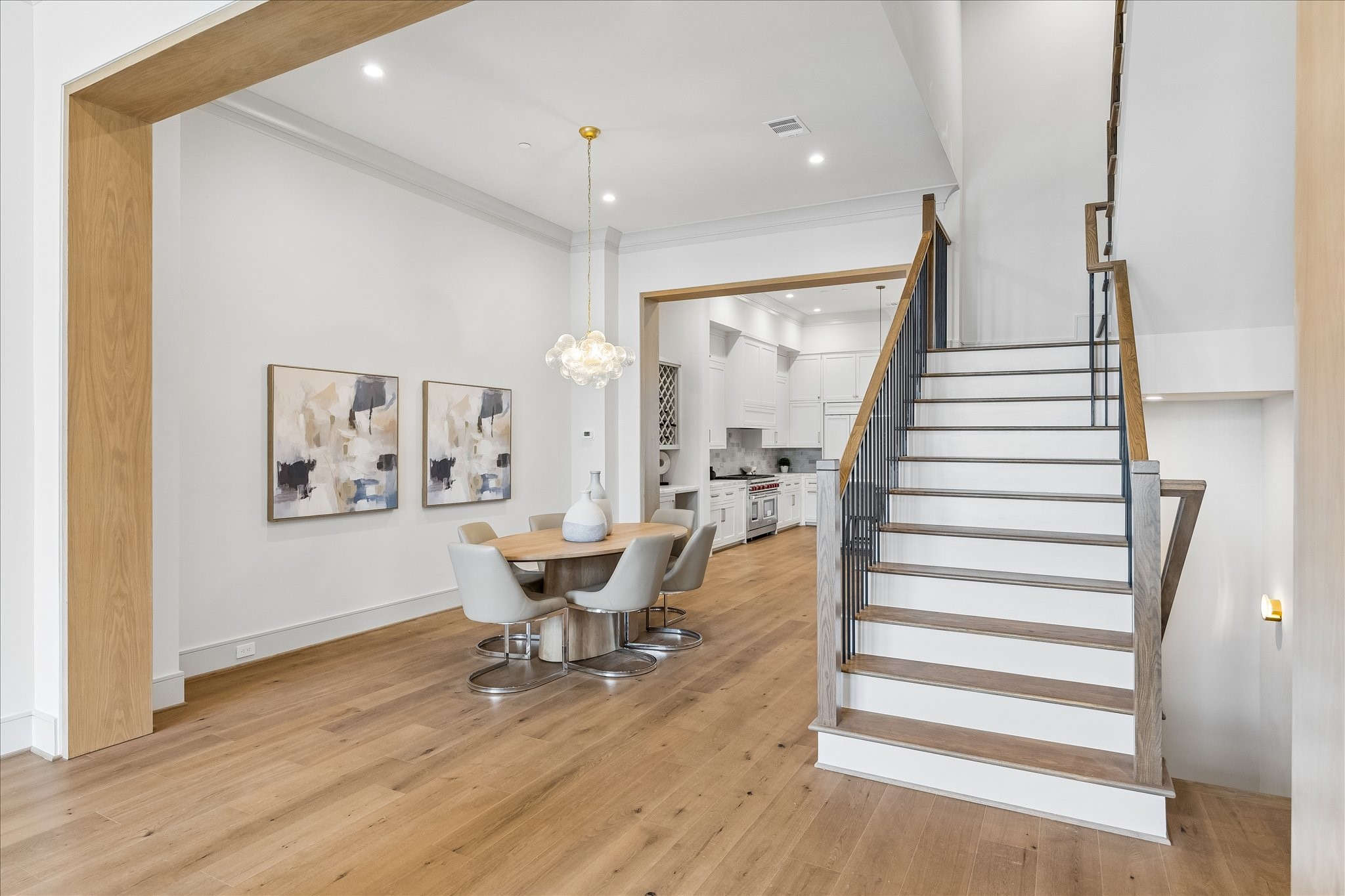 1215 West Pierce Street Houston, TX 77019 - Photo 10 of 37 The white oak-wrapped casement creates a dramatic division between the dining room and family room on the second floor. Large open rooms and high ceilings give this home a feeling that is both decadent and welcoming at the same time.