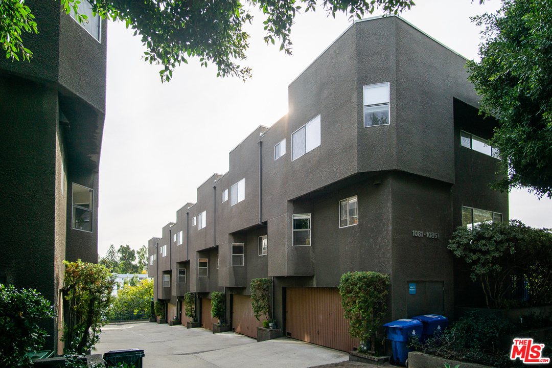 1085 West Kensington Road Los Angeles, CA 90026 - Photo 19 of 23 a front view of a house with a yard
