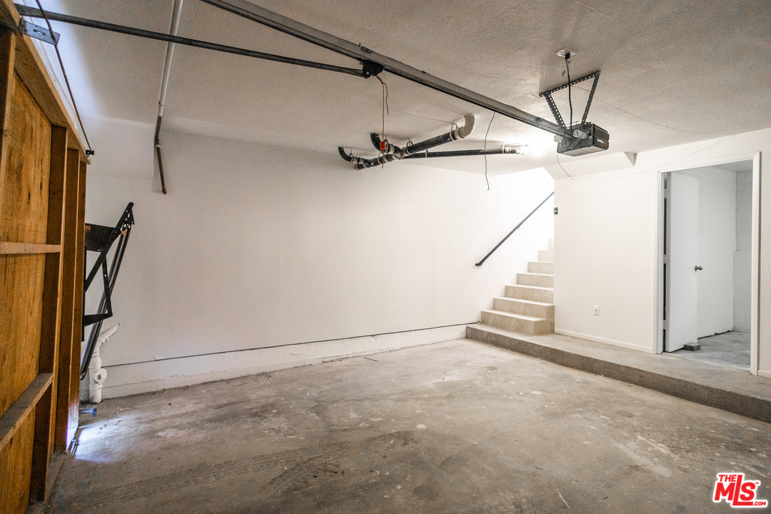 1085 West Kensington Road Los Angeles, CA 90026 - Photo 20 of 23 a view of a room with stairs