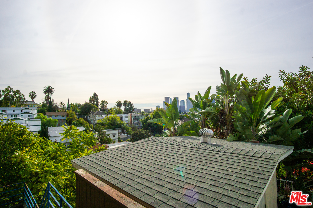 1085 West Kensington Road Los Angeles, CA 90026 - Photo 8 of 23 a view of a house with a yard