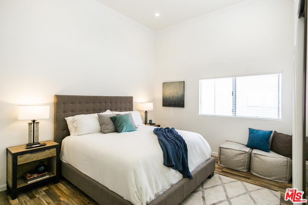 1085 West Kensington Road Los Angeles, CA 90026 - Photo 10 of 23 a bedroom with a bed and a couch
